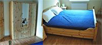 Das Schlafzimmer der Ferienwohnung - auch hier prägen Echtholzmöbel und Parkett den Gesamteindruck